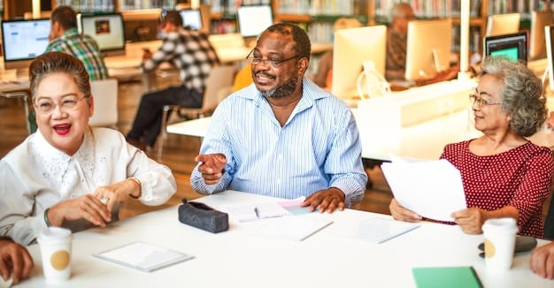 A diverse group of people smiling and engaged in a financial planning seminar. The whiteboard in the background displays the words 