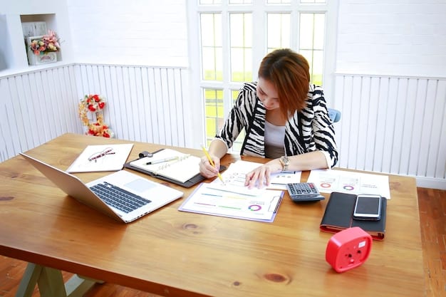 A person reviewing tax documents at a desk, with a calculator and laptop nearby, symbolizing the process of tax preparation and financial planning.
