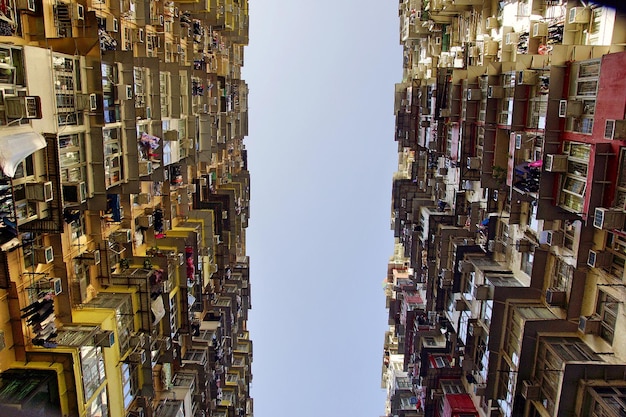 A split-screen image showing contrasting scenes: one side shows a thriving shopping district with bustling crowds, and the other side shows empty storefronts with a 