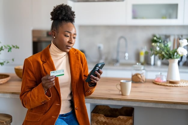A young adult using a credit card to make a purchase while consciously tracking expenses on a smartphone app, illustrating responsible credit management.