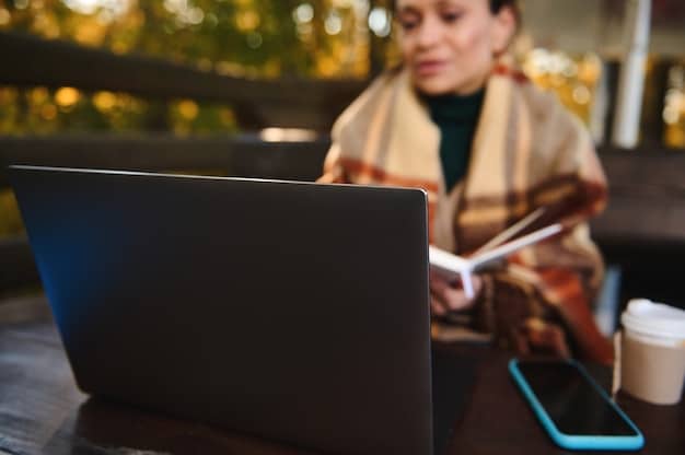 A student intently updating their LinkedIn profile on a laptop in a brightly lit coffee shop, focusing on carefully crafting the summary section, highlighting their skills and career goals.
