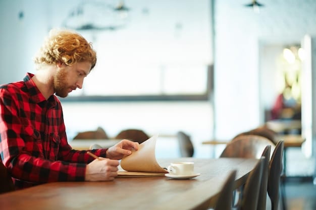 A student is sitting at a desk in a campus writing center, working on a paper with a tutor. The tutor is pointing to the screen and providing constructive feedback. The atmosphere is supportive and focused.