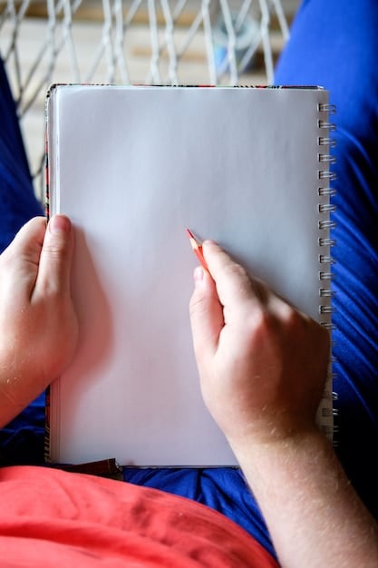 A close-up of a student's notebook showing the Cornell note-taking system, with clear sections for notes, cues, and a summary. The image should emphasize the organized structure and easy readability of this method, using natural light.