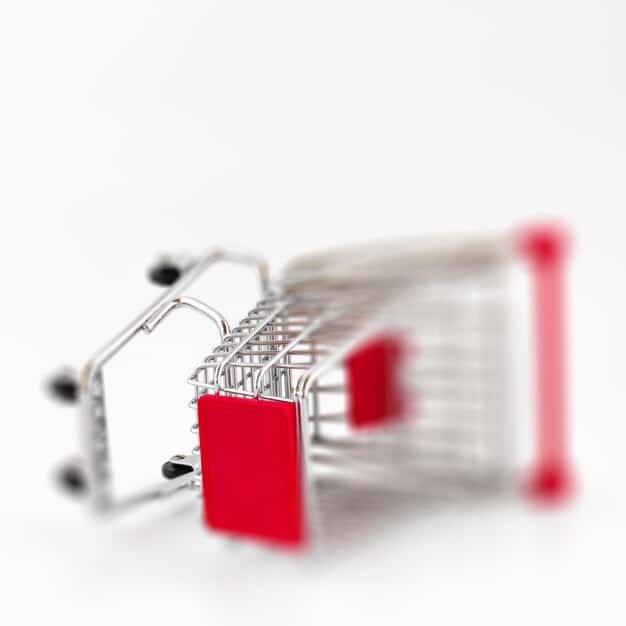 A close-up of a shopping cart with price tags rising above, symbolizing rising prices due to inflation.