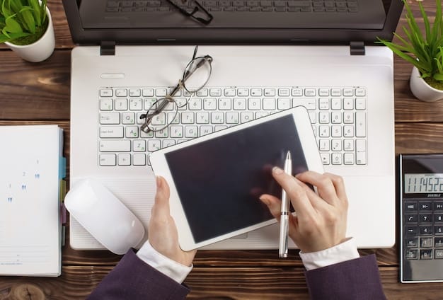 A person using a laptop with a 401(k) calculator displayed on the screen, showing calculations and potential growth projections, with a pen and notepad beside the laptop.