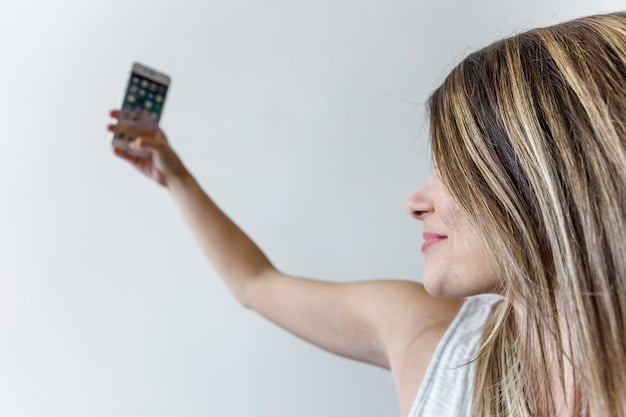 A person holding up a smart thermostat inside a modern home, showcasing energy-efficient home technology. The image represents saving energy and claiming related tax credits.