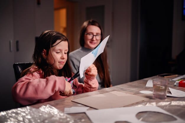 A parent helping a child with homework at a table illuminated by warm light, emphasizing the support and care that the Child Tax Credit helps provide for families.