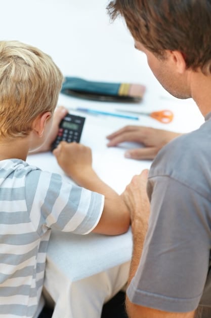 A close-up shot of a person completing tax forms with a calculator nearby, highlighting the process and tools involved in claiming the Child Tax Credit.