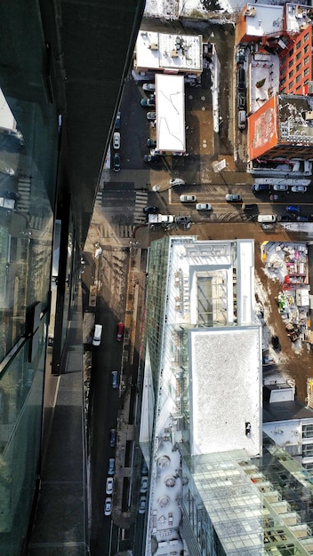 An aerial view of a modern, glass-encased headquarters of a crypto exchange. The building has a sleek, futuristic design, with flags from various countries displayed at the entrance, symbolizing its global reach.