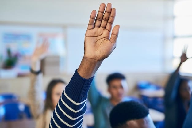 A diverse group of students raising their hands in a college classroom. Focus on engagement and active learning. Signs of accreditation logos in the background.