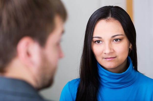 A close-up shot of a student making eye contact with the interviewer, smiling genuinely, and listening attentively, demonstrating active engagement and good communication.