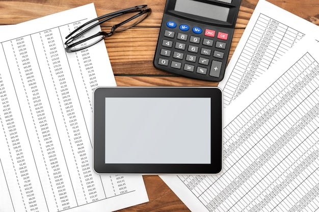 A close-up shot of a calculator displaying loan interest rates, with financial aid documents scattered around it, emphasizing the importance of understanding loan terms.