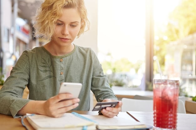 A college student using a budgeting app on their smartphone. The app displays charts and graphs of their income and expenses, making it easy to track their spending.
