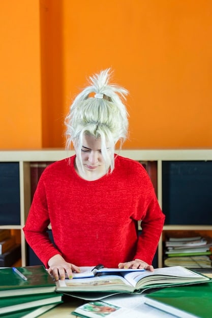 A split image. On one side, a person happily studying at a laptop with online course materials visible on the screen. On the other side, the same person looking frustrated in a crowded classroom.