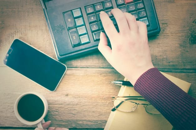 A close-up of a hand holding a calculator with a tax form in the background, symbolizing tax preparation and financial planning.