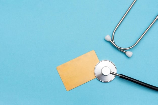 A close-up shot of a health insurance card, with a stethoscope resting on top. The background is blurred, focusing attention on the card and the medical instrument. This suggests the importance of health insurance for self-employed individuals.
